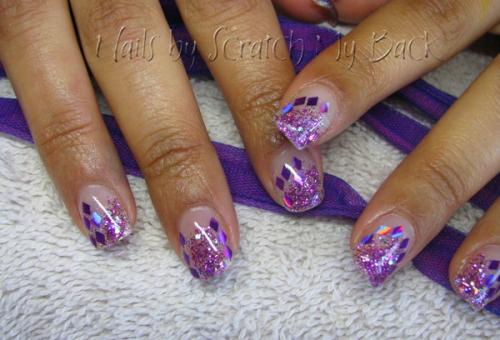 Gel nails with purple glitter and mylar