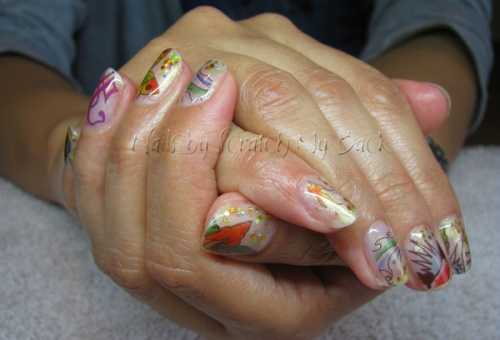 Gel nails decorated with temporary tattoos