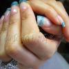 Gel nails with blue glitter sparkles on free edge