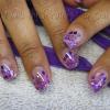 Gel nails with purple glitter and mylar